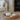 A round water hyacinth tray with ceramic pumpkins on