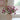 A faux flower arrangement in a terracotta vase