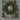 Soft touch faux LED conifer Christmas wreath hanging on a sage green door