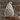 LED Ceramic Gonk in rough white ceramic with wholes cut into its hat, lit up